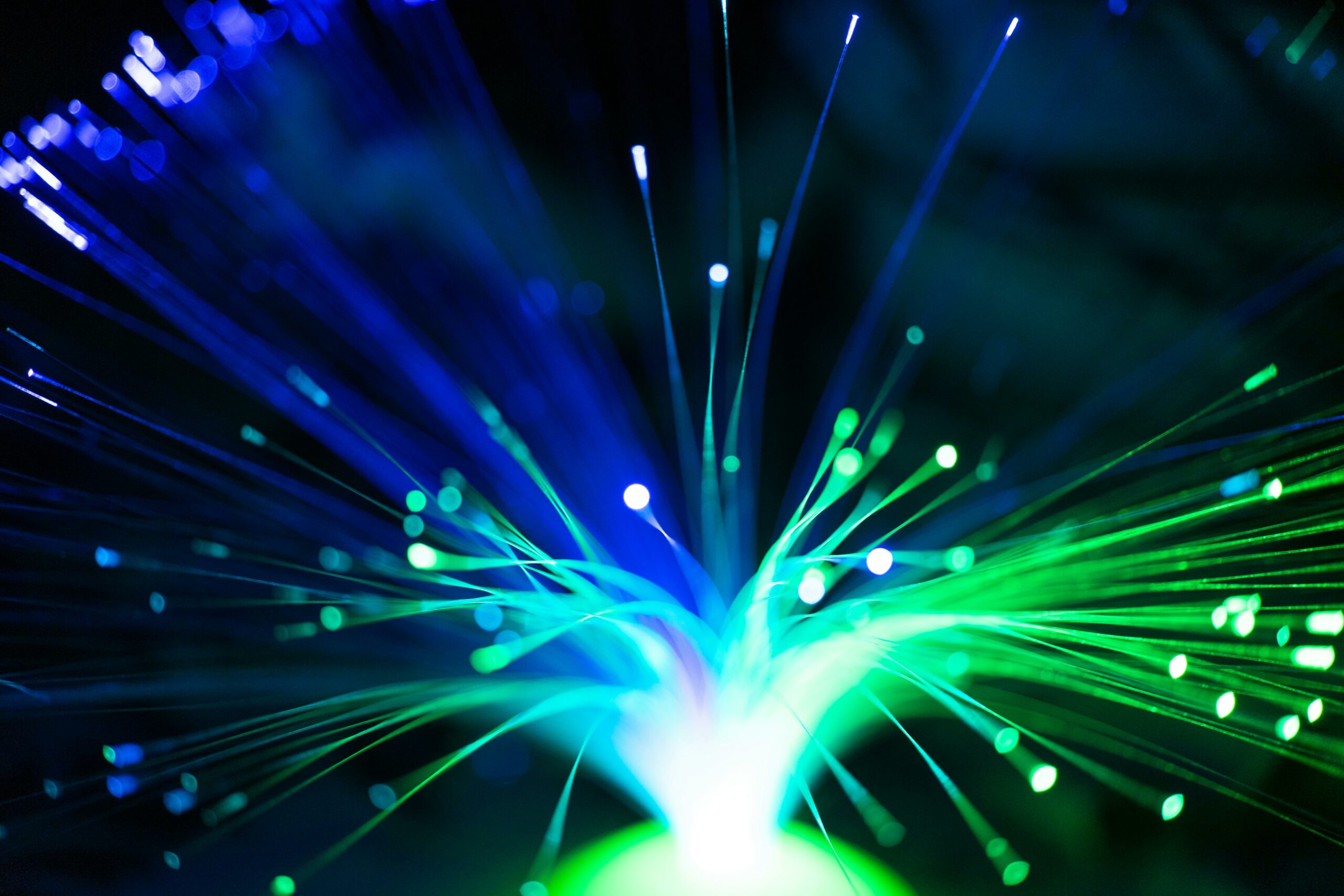 Close-Up Shot of a Green and Blue Fiber Optic.